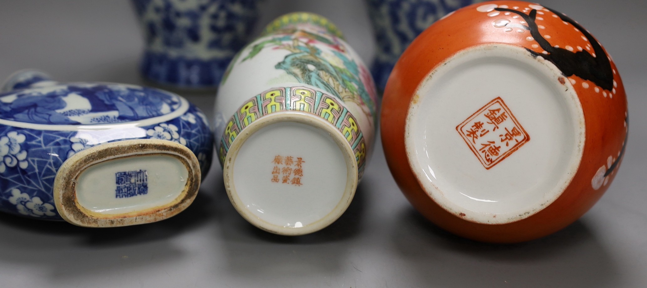A pair of Chinese blue and white vases, two other vases and a moon flask, tallest 28cm